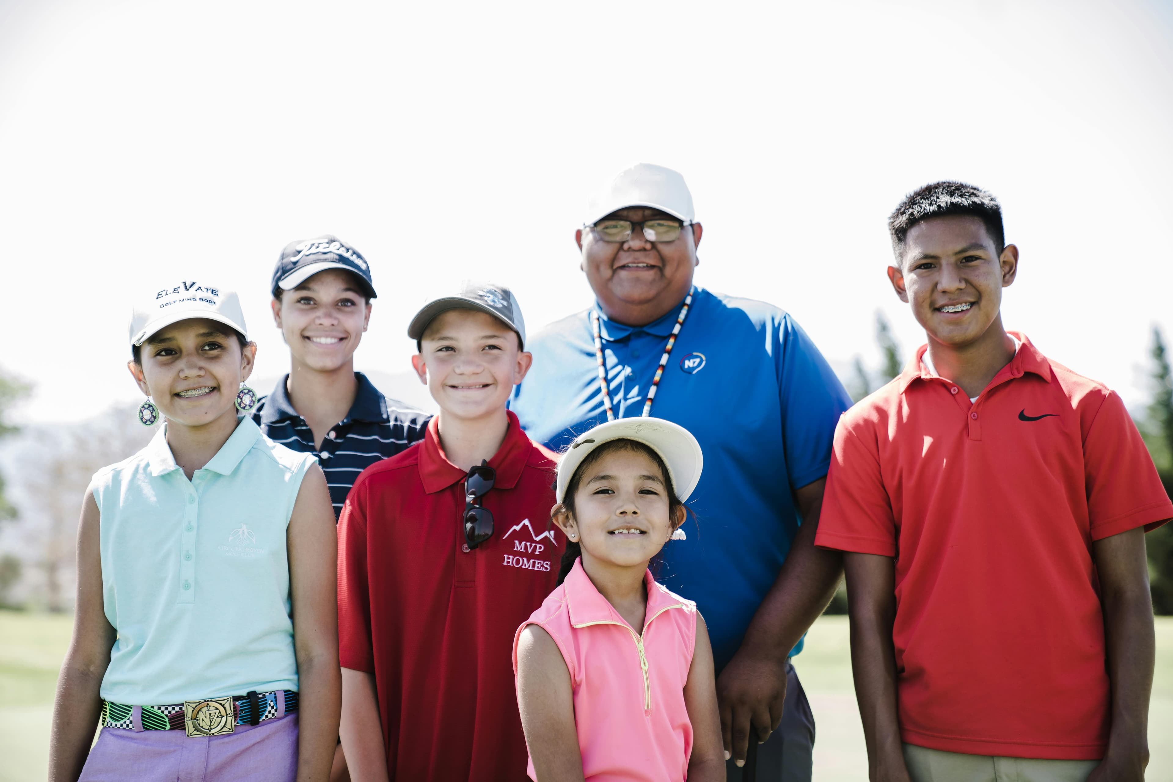Joyful group of friends enjoying a sunny day of golf together